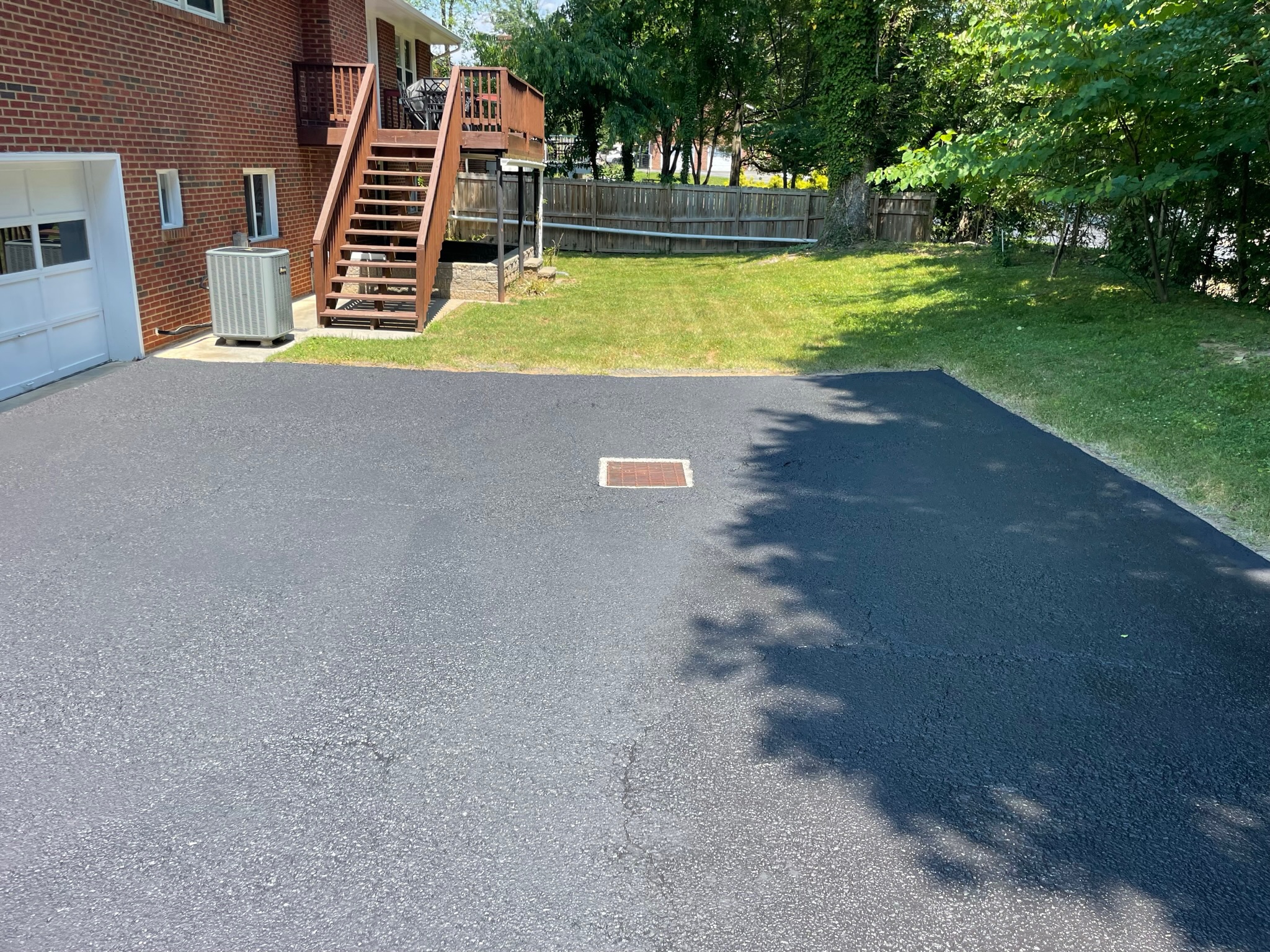 Fresh sealcoated driveway by Grit to Gloss